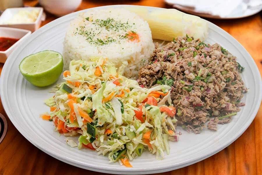 White rice with salad, shredded meat and cassava