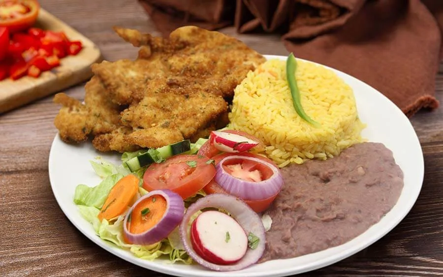  Yellow rice with salad, breaded chop and bean sauce
