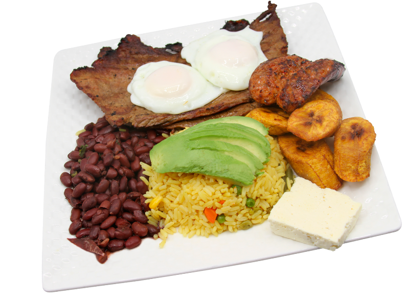 Plate with yellow rice and avocado on top accompanied by beans, meat, chorizo and plantain